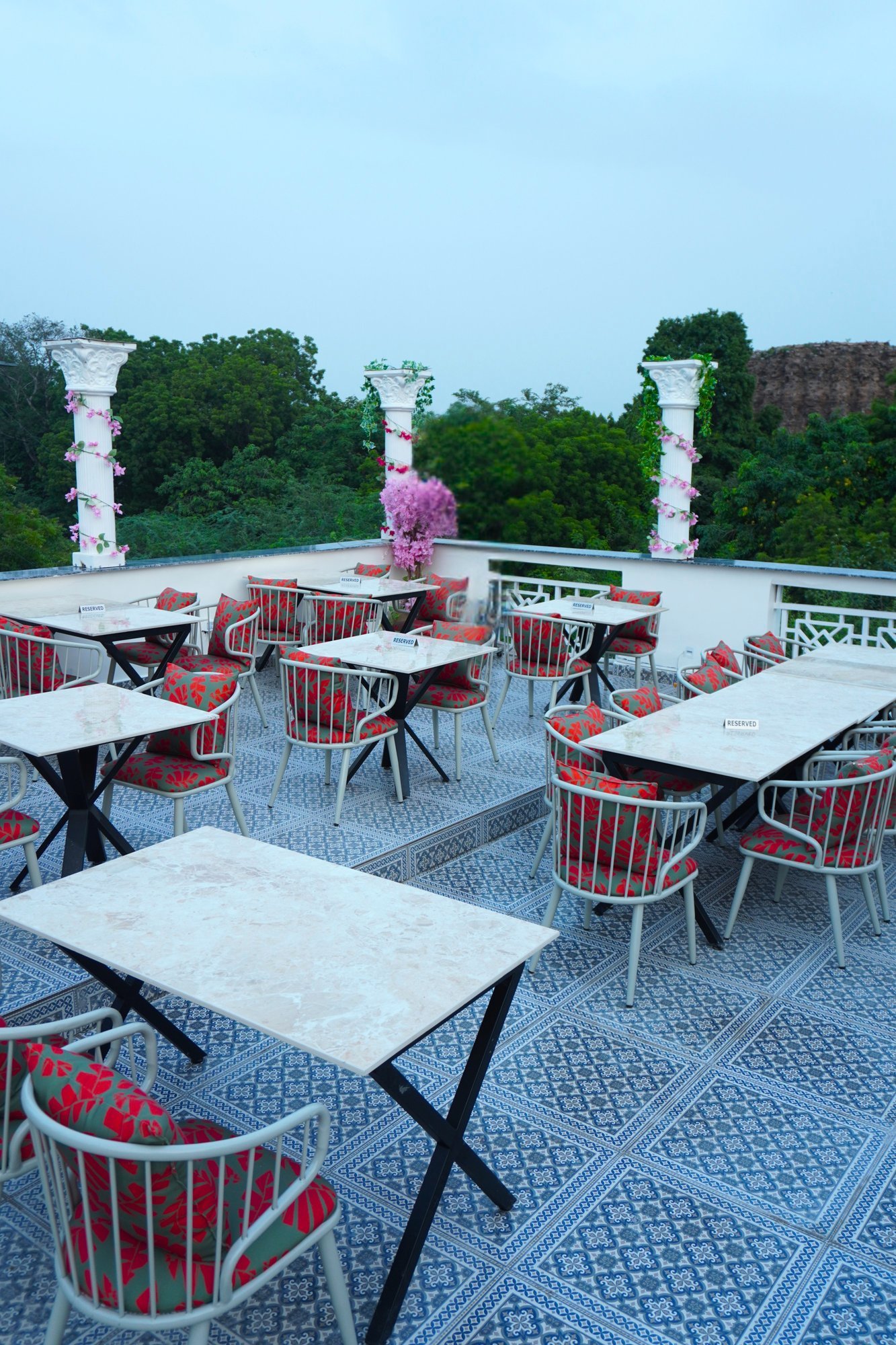 Alora Delhi rooftop terrace with white pillars